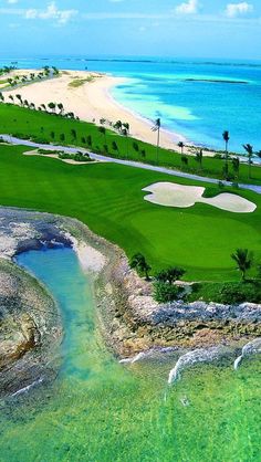 an aerial view of a golf course near the ocean