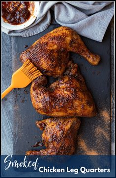 grilled chicken leg quarters with bbq sauce and fork on slate board next to napkin