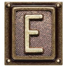 the letter e is made out of metal and has an embossed pattern on it