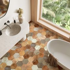 an aerial view of a bathroom with hexagonal tiles on the floor and walls