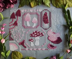 a cross stitch pattern with pink flowers and green leaves on the bottom, along with other items