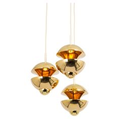 three golden lights hanging from the ceiling