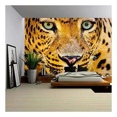 a bedroom with a large tiger mural on the wall