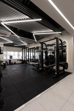 the gym is clean and ready for people to use it as an exercise center in this modern building