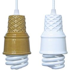 two white and gold ceramic light bulbs