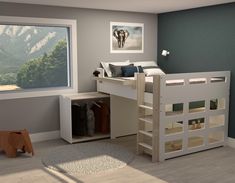 a child's bedroom with a bunk bed, desk and toy elephant on the floor