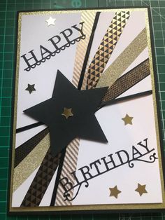 a birthday card with gold and black stars