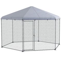 a large metal dog kennel with a white cover