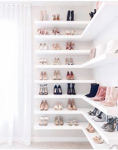 there are many pairs of shoes on the shelves