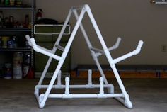 an upside down white sculpture in a garage