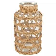 a wicker vase with a glass top and lid is shown in this image on a white background