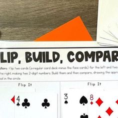 the flip, build, compare card game is displayed on a table with other cards