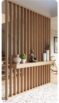 there is a shelf with plants on it in front of a wall made out of wooden slats