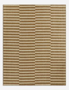 a brown and white rug with vertical stripes