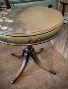 a round table sitting on top of a carpeted floor