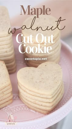 heart shaped cut out cookies on a pink plate with the words maple walnut cut out cookie