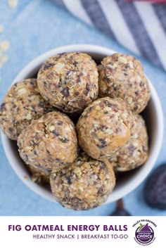 a white bowl filled with oatmeal raisin energy bites next to dates