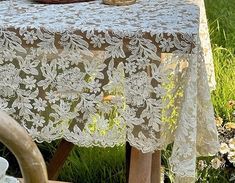 a table covered with a white lace cloth