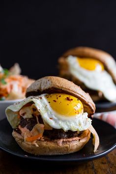 an egg is on top of a hamburger