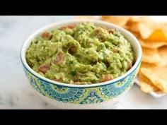 a bowl filled with guacamole and chips