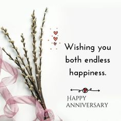 a happy anniversary card with flowers and ribbon on the side, saying wishing you both endless happiness