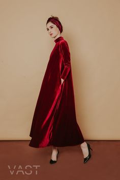 Following the brand's romantic lines and flowing silhouettes, this gown from VAST embodies the brand's elegance thanks to a maxi-style construction in a signature ruby red shade, presents the ultimate in opulence and drama, in a one-tone velvet look. Turtle neckline Long sleeves Flare silhouette Maxi length Loose fit Oversized winter dress Romantic Lines, A Line Long Dress, Baggy Dresses, Maxi Dress Winter, Low Back Dresses, Red Velvet Dress, Velvet Maxi, Velvet Maxi Dress, Frill Dress