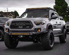 a gray toyota truck parked in a parking lot