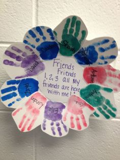 handprints are arranged in the shape of a flower with words written on it