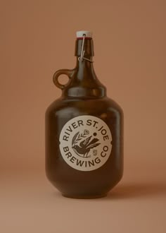 a brown glass bottle sitting on top of a table