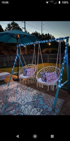 two hanging chairs with blue lights on them