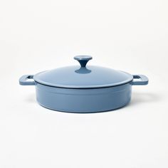 a blue casserole dish on a white background