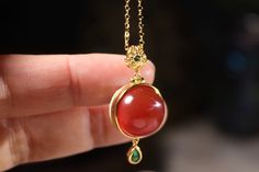 red agate enamel locket pendant necklace. the whole body is solid S925 silver. pendant size 33mm, one side set with red agate and the other side enamel. it comes with 18" gold plated silver necklace. 复古国风烧蓝红玛瑙香囊吊坠。通体925银镀k金，整体高 33mm，配18寸银链。 Enamel Locket, Silver Locket, Locket Pendant Necklace, Stylish Bracelet, Silver Lockets, Red Agate, Whole Body, Gold Plated Silver, Pendant Necklaces