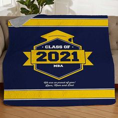 a blue and yellow graduation blanket that says class of 2021