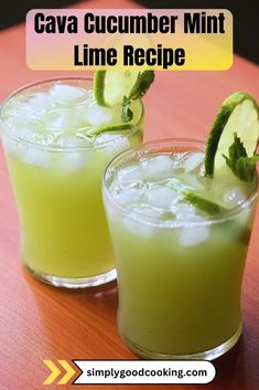 two glasses filled with cucumber mint lime drink sitting on top of a wooden table