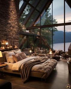 a large bed sitting in the middle of a bedroom next to a tall glass window