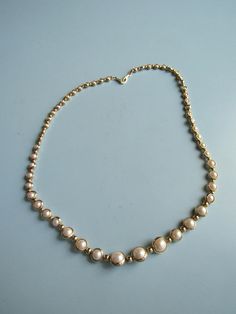 This vintage gold tone and faux pearl necklace is in good condition.  It is about 18 1/2 inches long and is ready to wear. Free domestic shipping. Faux Pearl Necklace, Beaded Necklaces, Vintage Gold, Faux Pearl, Pearl Necklace, Gold Tones, Ready To Wear, Beaded Necklace, Jewelry Necklaces