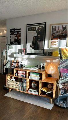 a living room filled with furniture and pictures on the wall