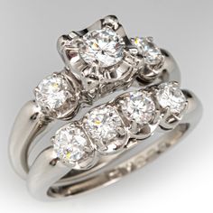 This beautifully crafted two ring wedding set consists of a diamond engagement ring and harmonizing diamond band. The engagement ring is centered with one (1) round brilliant cut diamond set into a four-prong illusion head. The shoulders of the engagement ring are each accented with one (1) prong set round brilliant cut diamond. The wedding band is accented with four (4) prong set round brilliant cut diamonds. The set measures 12.0mm at the top, rises 7.7mm above the finger, tapering to 3.3mm wi Ring Wedding Set, Antique Engagement Rings Sapphire, Estate Jewelry Rings, Wedding Ring Diamond Band, Morganite Diamond, Diamond Wedding Sets, Beautiful Engagement Rings, Antique Engagement Rings, Wedding Set