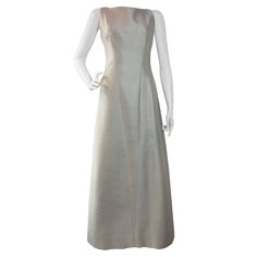 1960s Bob Bugnand Ivory Shantung Sculpted Evening Gown | From a collection of rare vintage evening dresses and gowns at https://www.1stdibs.com/fashion/clothing/evening-dresses/ Cream Fitted Bodice Evening Dress For Gala, Elegant Full-length Wedding Dress, Elegant Cream Wedding Dress For Ceremony, Fitted Cream Gown For Gala, Elegant Cream Gown For Ceremony, Formal Full-length Cream Dress, Cream Full-length Formal Dress, Elegant Sleeveless Gown For Ceremony, Formal Full Length Cream Dress