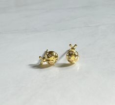 Pair these sweet little ladybug studs with more earrings or wear alone. Perfect for day or night.  18k gold plated over 925 sterling silver 8mm x 6mm Ladybug Earrings, Stud Earrings Gold, Gold Earrings Studs, Gold Studs, Earrings Gold, Jewelry Earrings Studs, Sterling Silber, Gold Earrings, Etsy Earrings