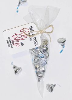 a bag filled with lots of silver candies