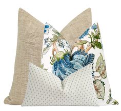 two pillows with blue and white flowers on them