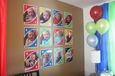 a room with balloons and pictures on the wall