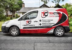 a red and white van parked in front of a house