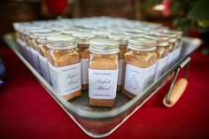 there are many jars on the tray with labels for each individual to put in them