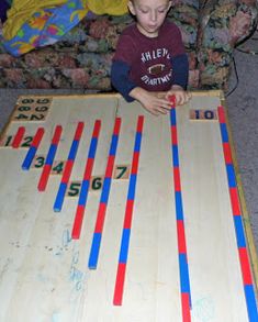 a young boy playing with an interactive board game