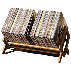 two wooden racks holding records on top of each other