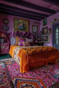 a bedroom with purple walls and colorful rugs on the floor, along with an orange bed