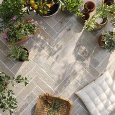 an overhead view of a patio with potted plants