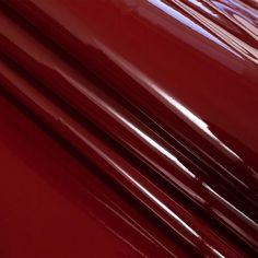 red plastic sheets stacked on top of each other